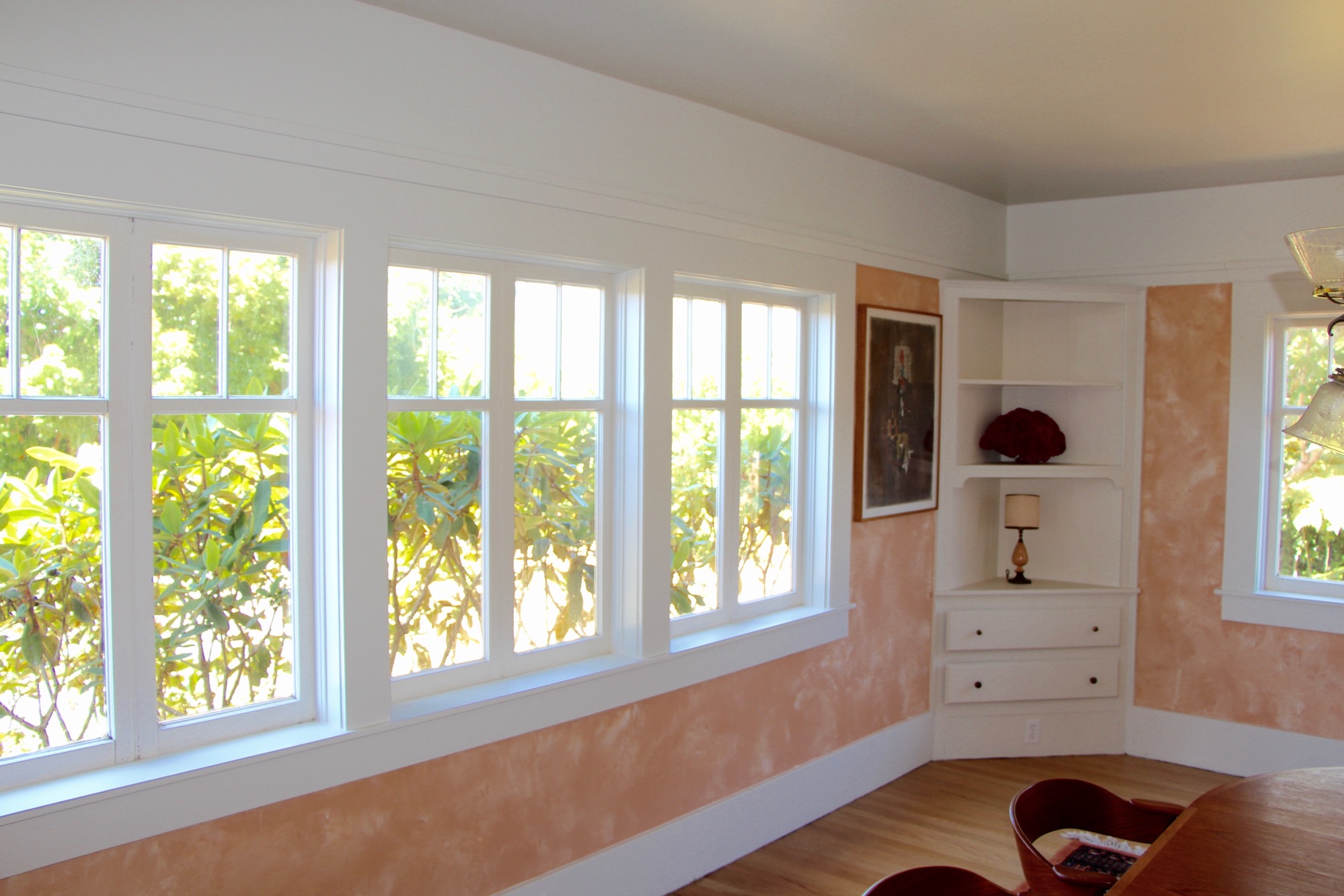 Bright finished room with warm decorative wall surfaces and clean window trim